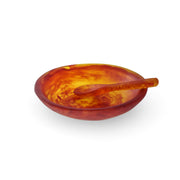 POLKA LUKA amber resin relish bowl with matching small spoon featuring a marbled translucent finish.