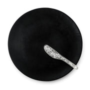 POLKA LUKA large black resin Luna serving plate with a clear textured cheese knife, top-down view.