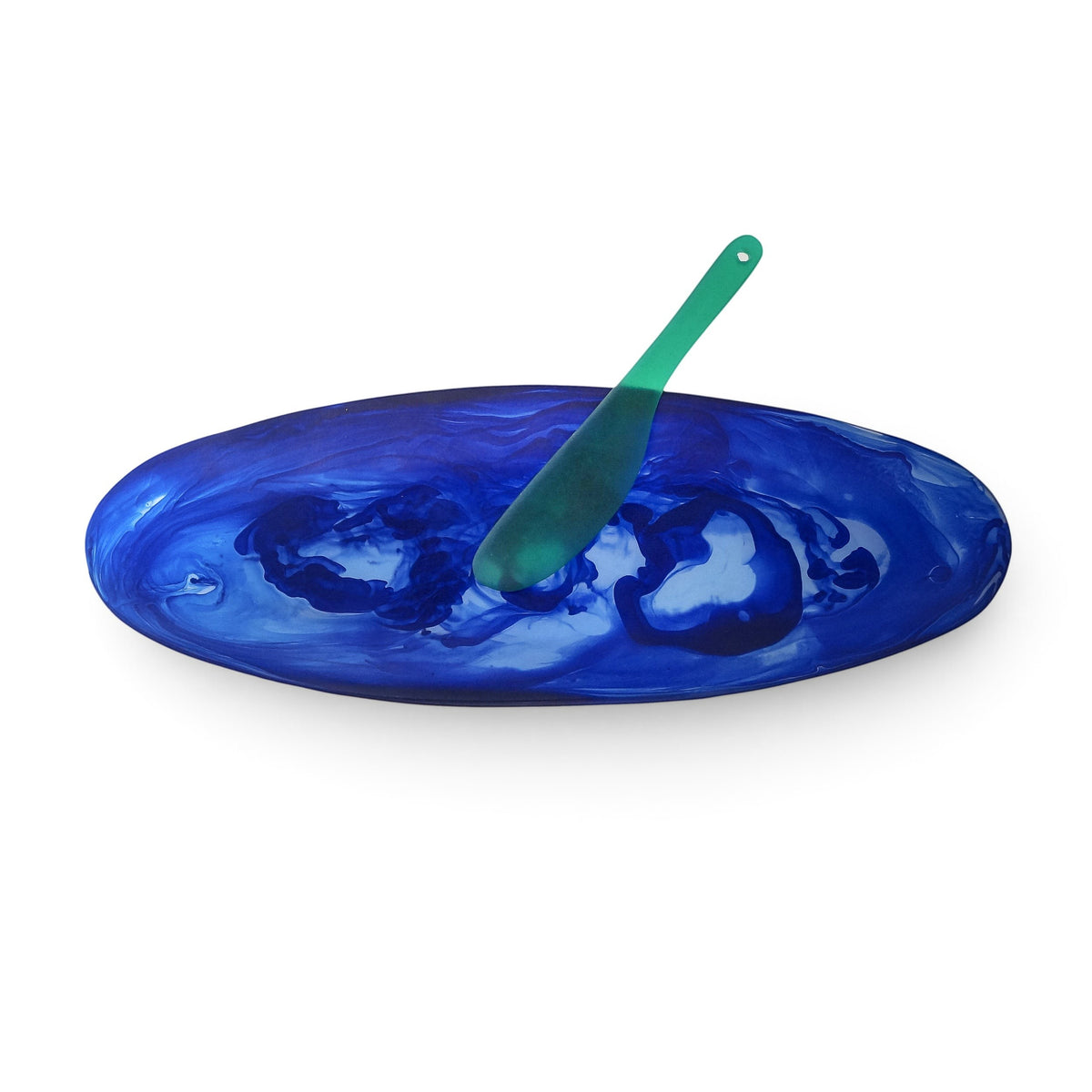 POLKA LUKA oval blue marbled resin serving platter with a matching translucent green cheese knife