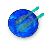POLKA LUKA large blue resin salad bowl with matching translucent green salad servers, top-down view.