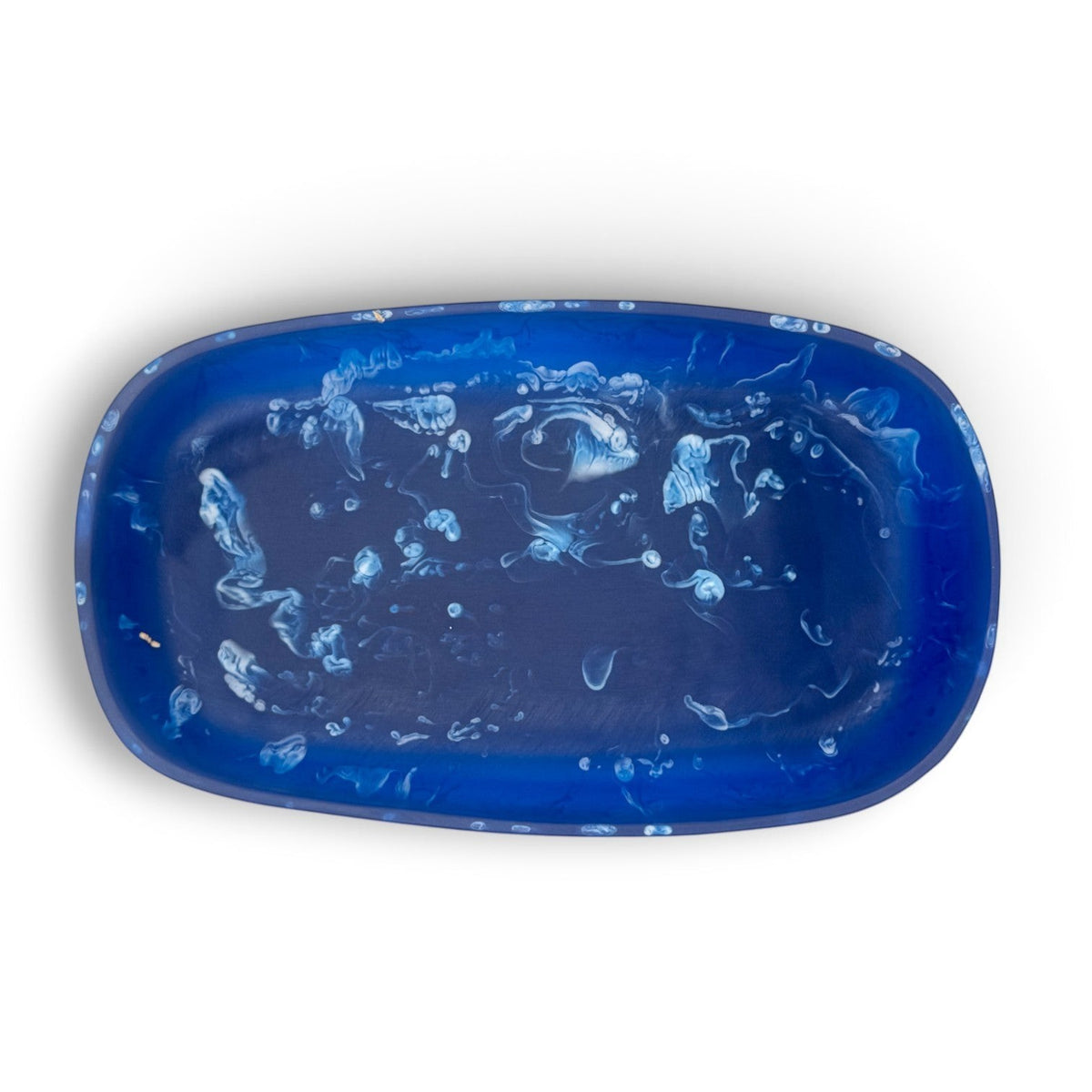 POLKA LUKA Cezanne rectangular resin serving bowl in deep blue with white marbled swirl patterns, top-down view.