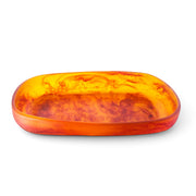 POLKA LUKA Cezanne rectangular resin serving bowl in a translucent amber and orange marbled pattern