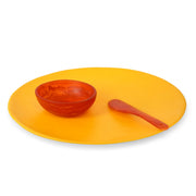 POLKA LUKA Luna serving set with a large yellow plate, orange marbled dip bowl, and matching cheese knife.