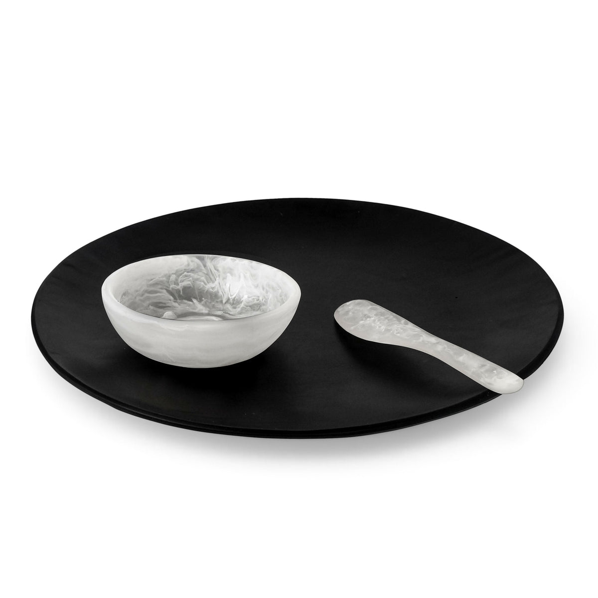 POLKA LUKA Luna serving set featuring a large matte black plate, white marbled dip bowl, and matching cheese knife.