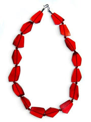 POLKA LUKA abstract necklace featuring translucent red geometric resin beads on a cord