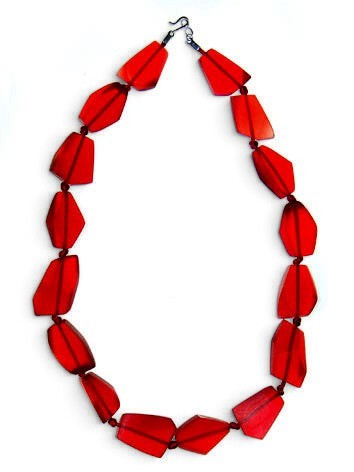 POLKA LUKA abstract necklace featuring translucent red geometric resin beads on a cord