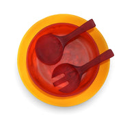POLKA LUKA resin salad set featuring a yellow serving plate, red bowl, and matching red salad servers from above.
