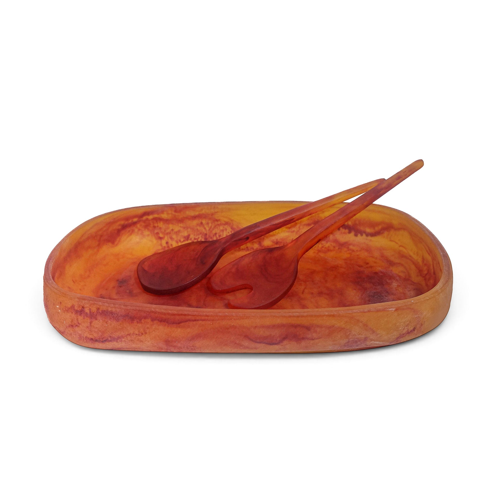 POLKA LUKA Cezanne resin serving bowl and Gauguin salad servers in a marbled amber and orange finish.