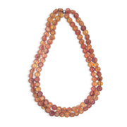 POLKA LUKA Silk Road double strand necklace featuring translucent amber-toned resin beads on stretch elastic