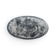 POLKA LUKA small oval resin bowl featuring a black and white marbled swirl pattern for jewellery or food serving.