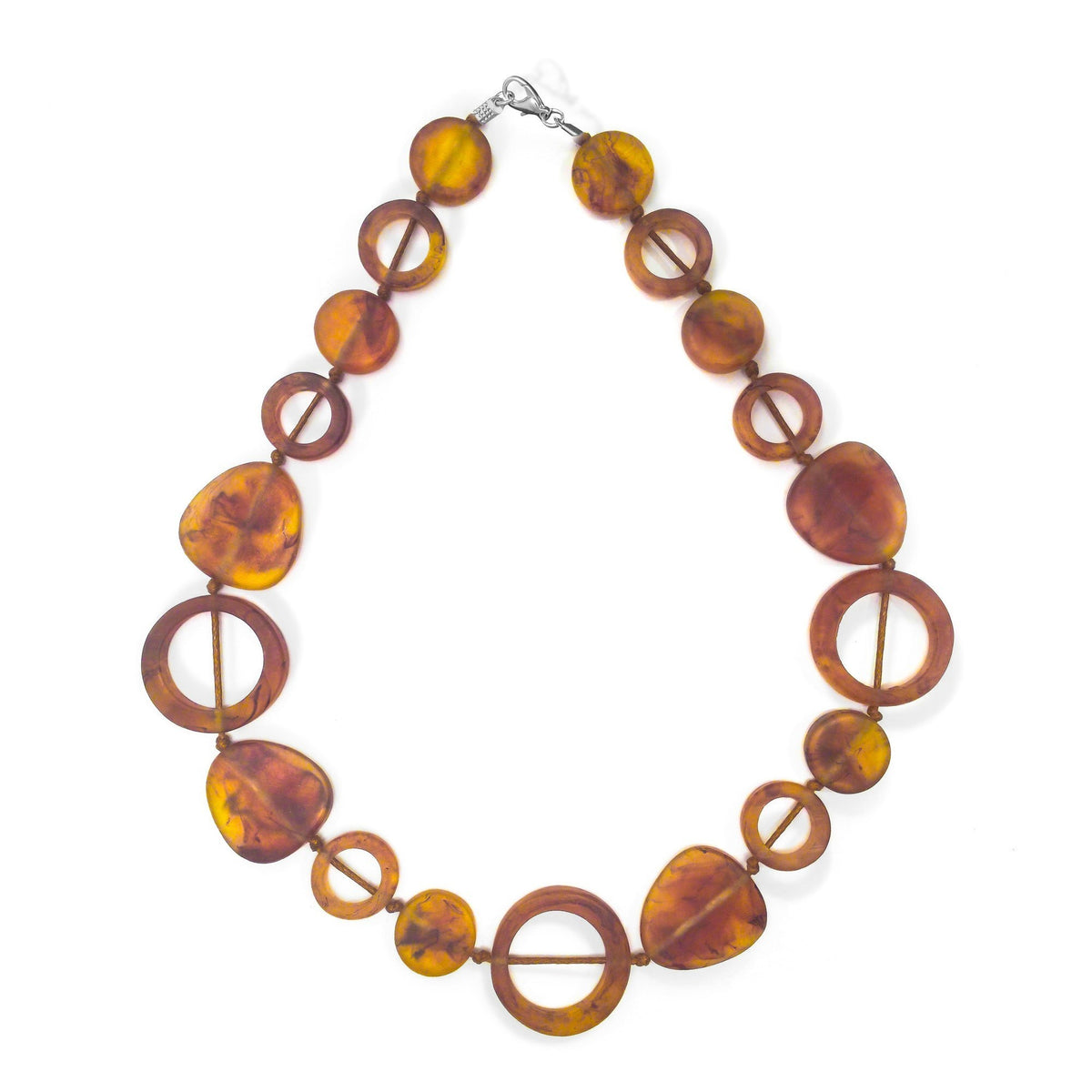 POLKA LUKA Tangier necklace featuring amber-toned resin geometric beads on a cotton cord, 54cm length.
