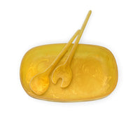 POLKA LUKA yellow resin oval serving bowl with matching salad servers featuring a unique hand-mixed marbled pattern.