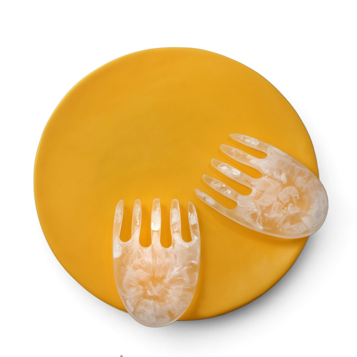 POLKA LUKA large yellow resin Luna serving plate with translucent white marbled salad hands on a white background